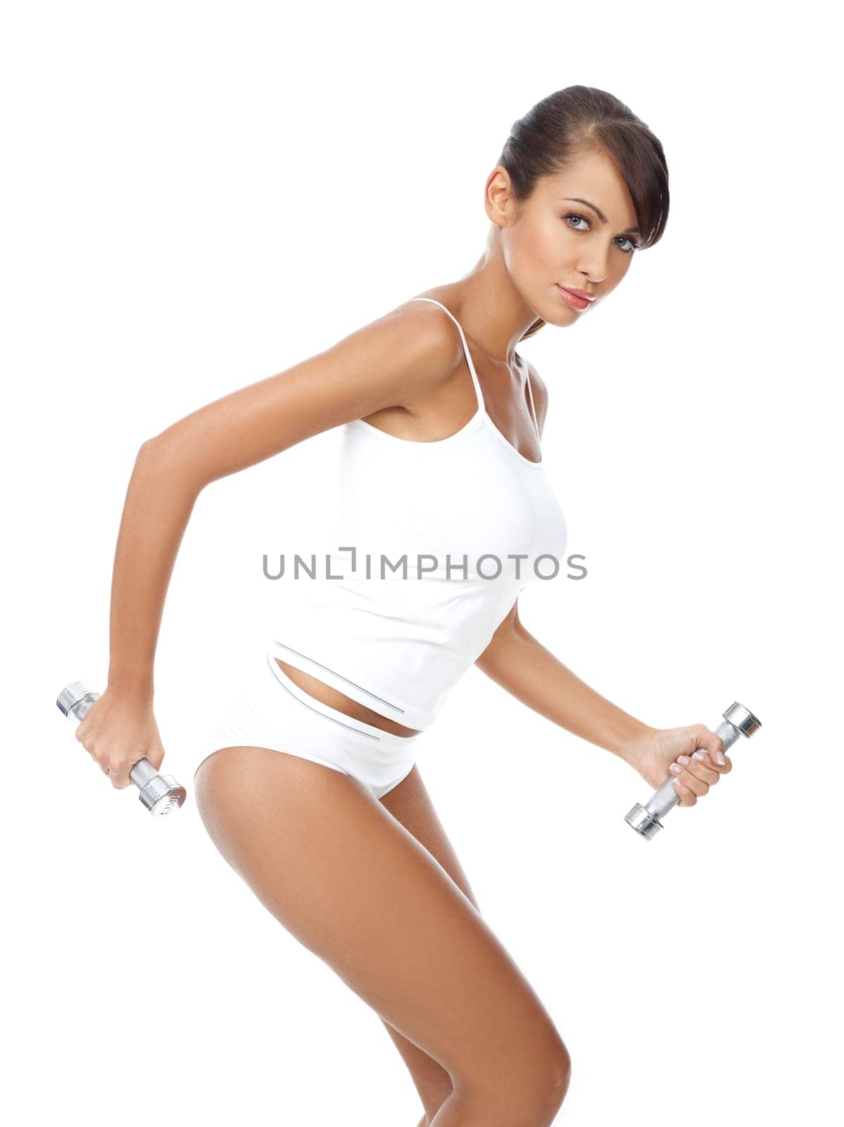 Young beautiful woman with dumb-bells in hands
