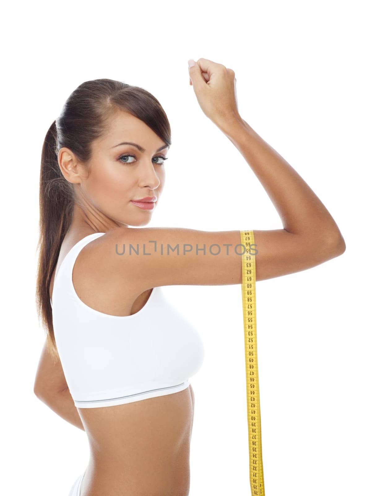 Young beautiful woman with measure tape on white