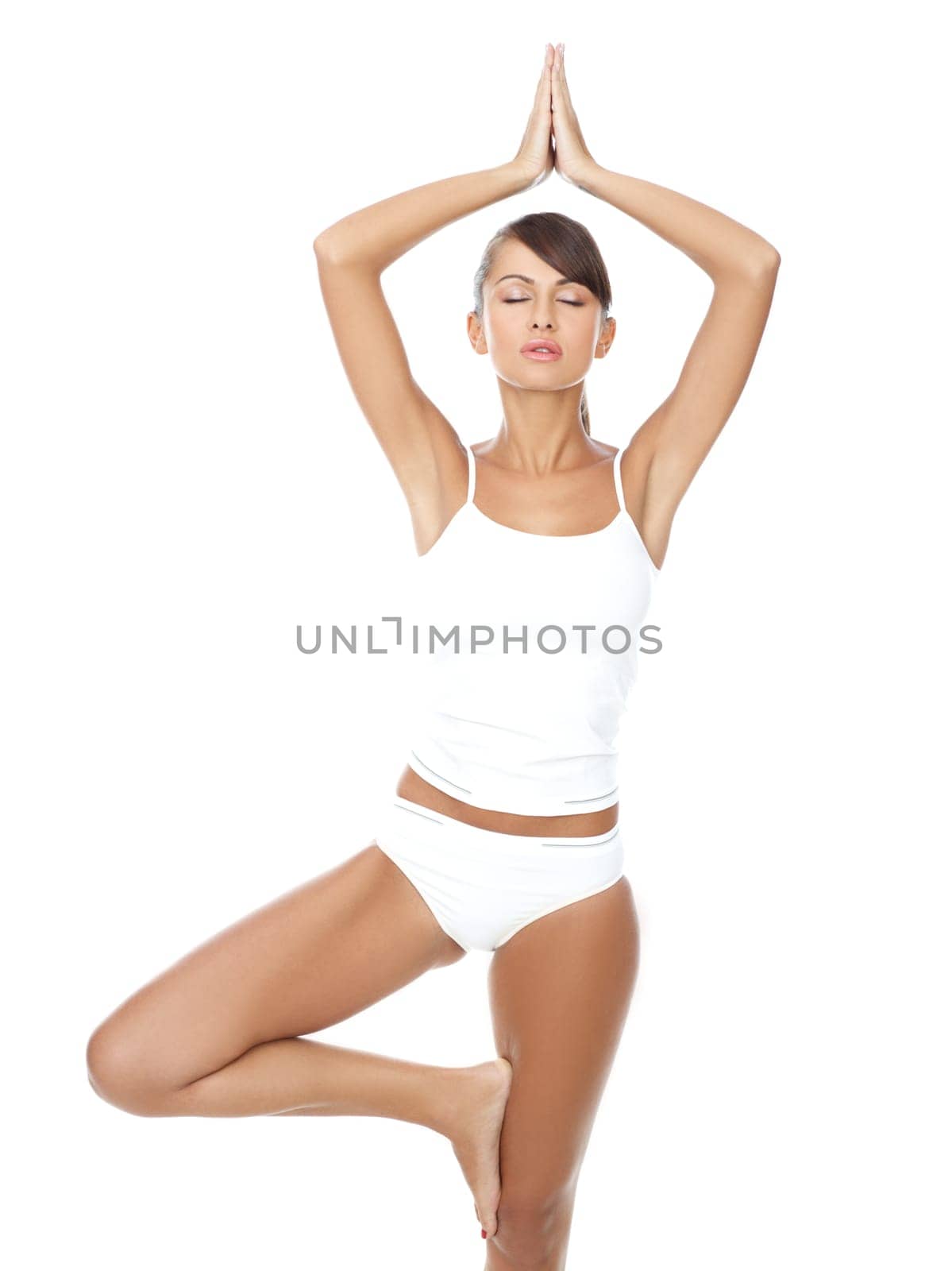 Young beautiful woman in yoga position on white