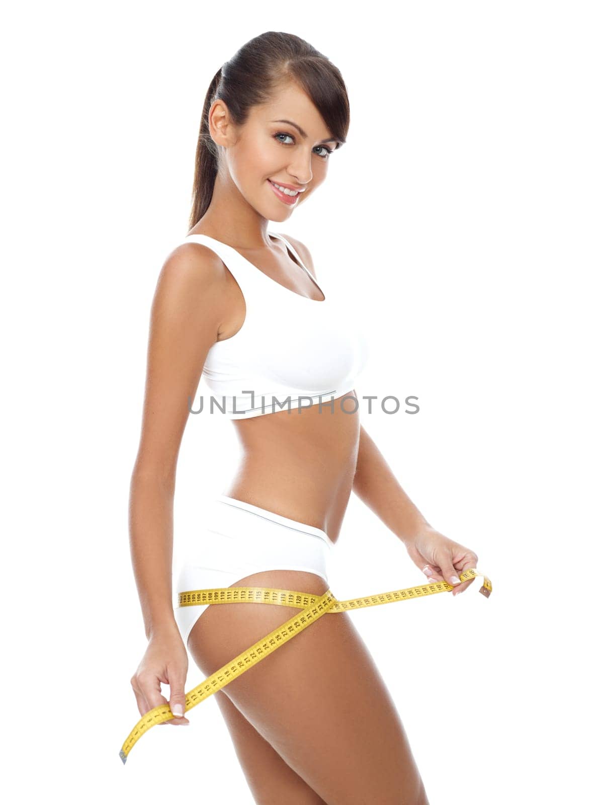 Young beautiful woman with measure tape on white