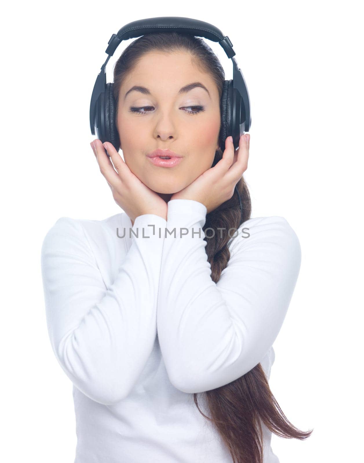 Beautiful young lady is listen to the music, isolated