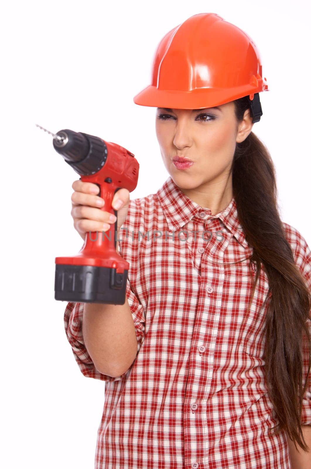 Female worker with drill in her hand, isolated