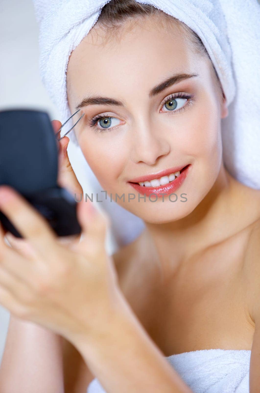 Portrait of cute teenage girl doing morning makeup