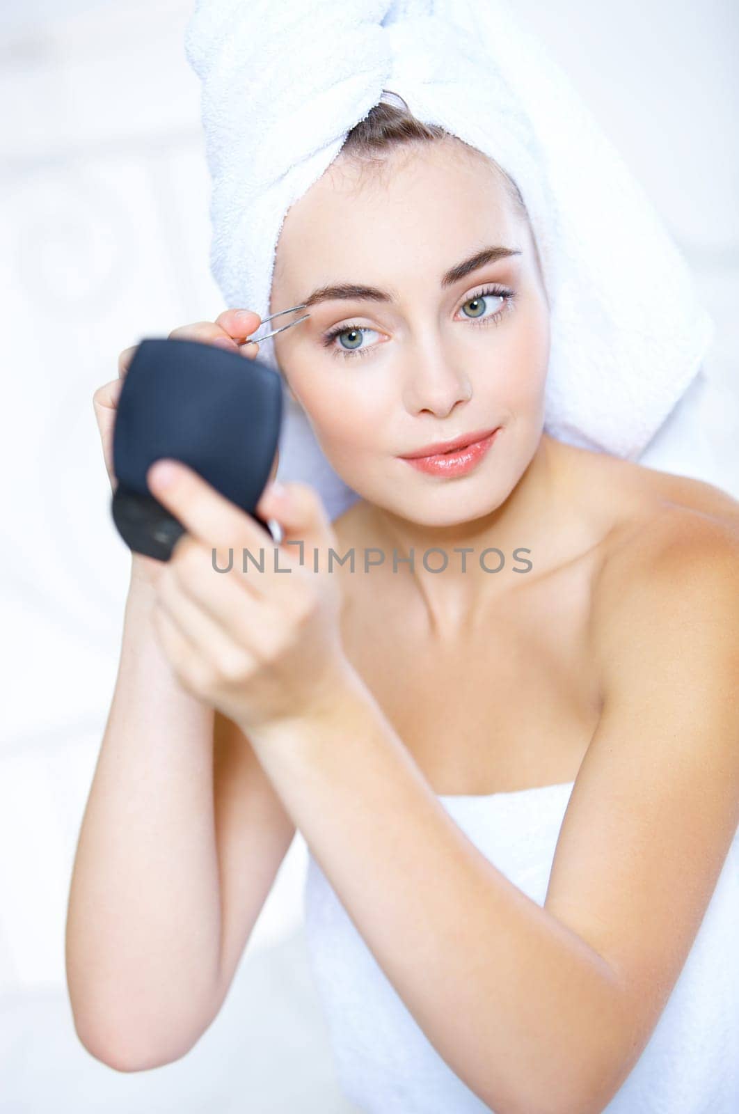 Portrait of cute teenage girl doing morning makeup