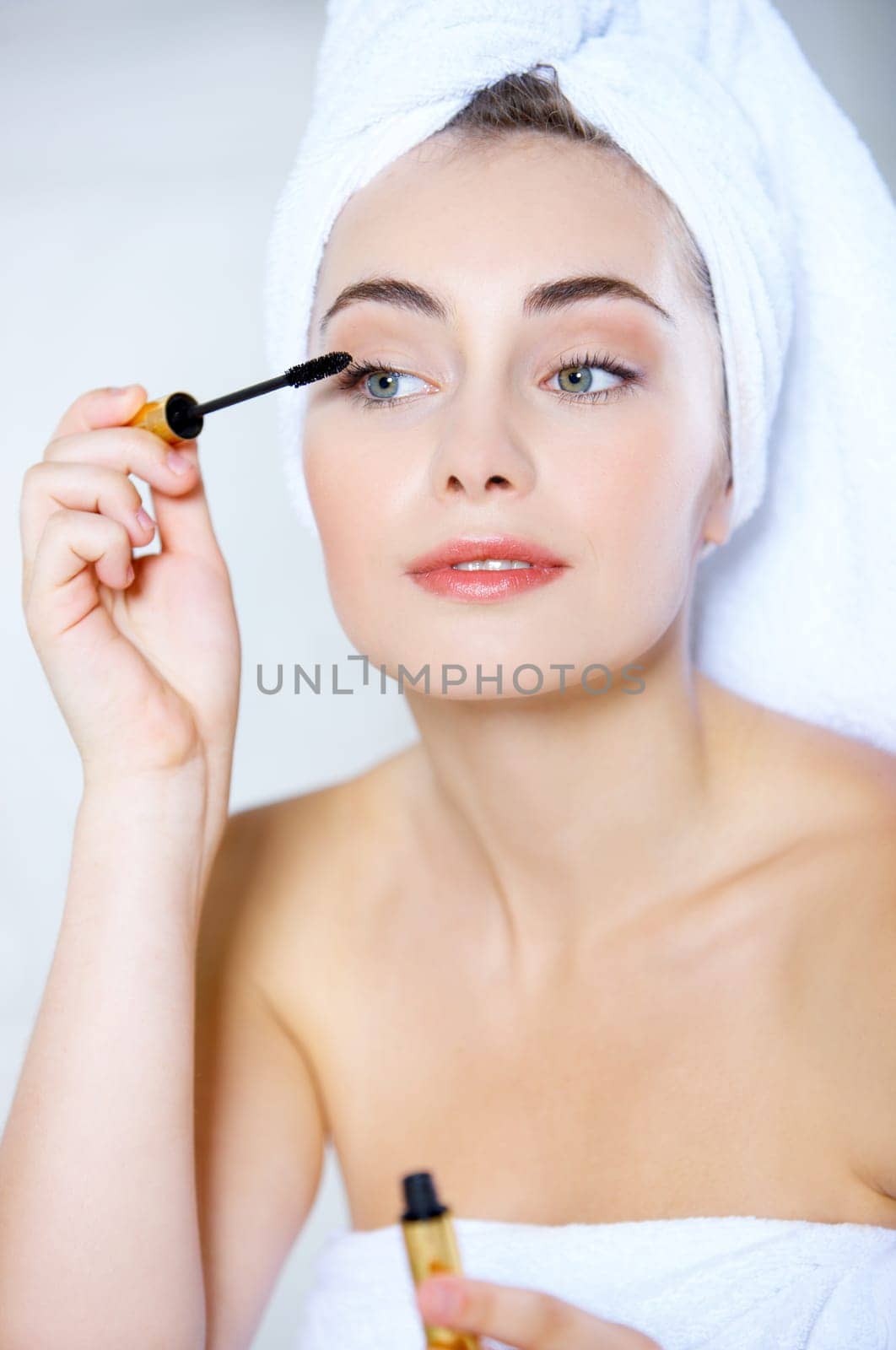 Portrait of cute teenage girl doing morning makeup