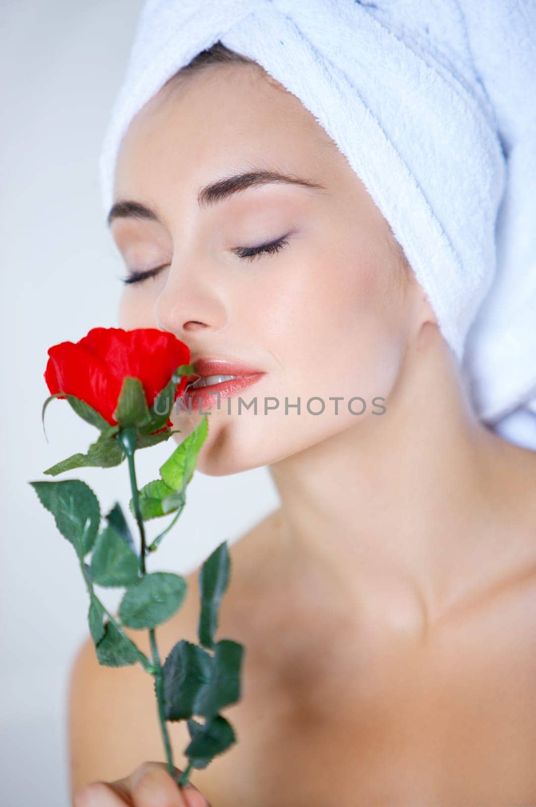 Portrait of cute teenage girl with red rose