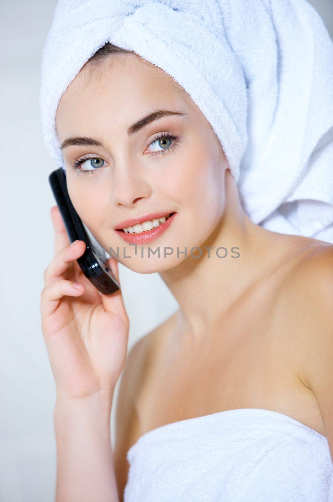 Portrait of cute teenage girl using mobile phone