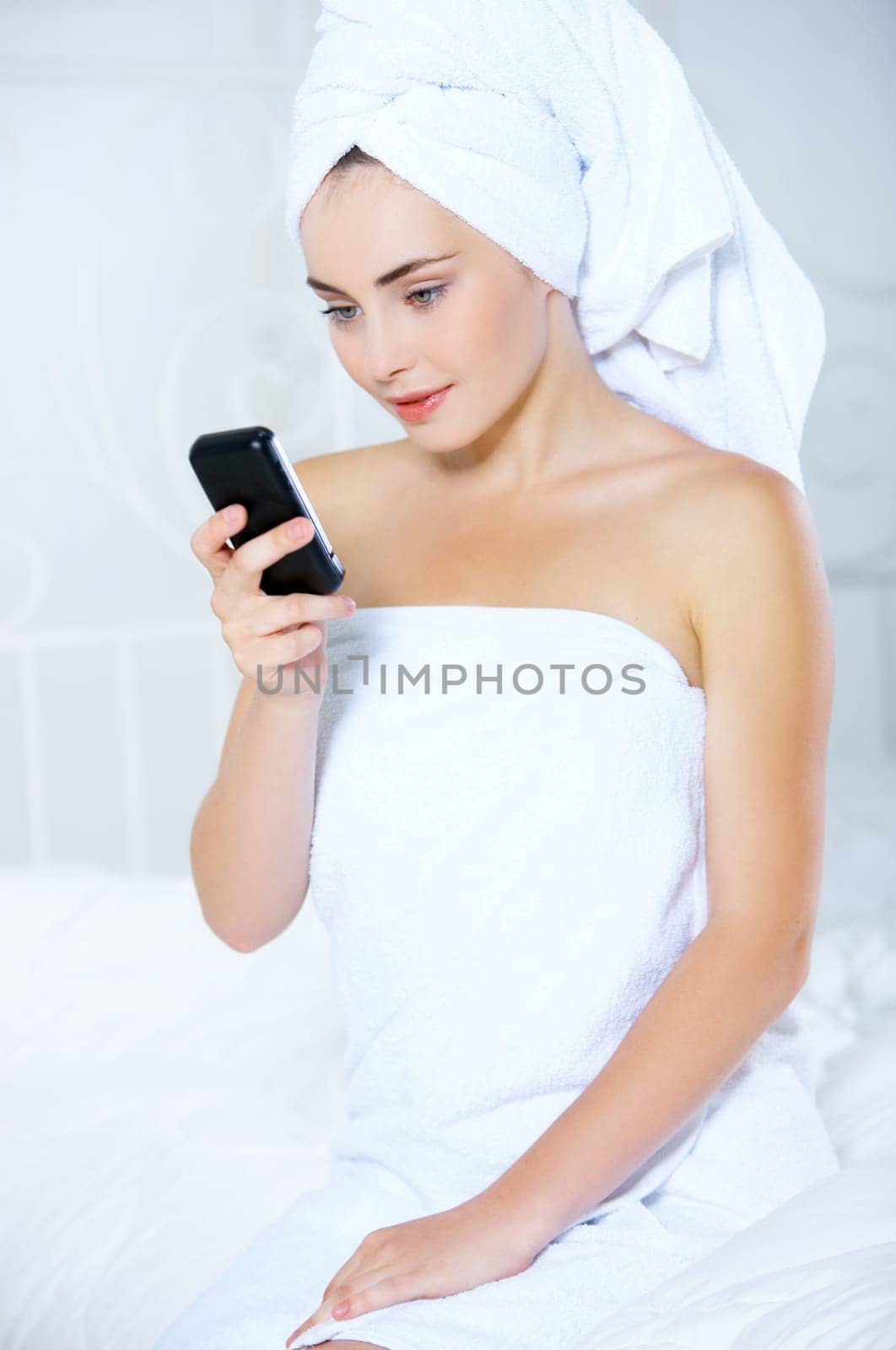 Portrait of cute teenage girl using mobile phone