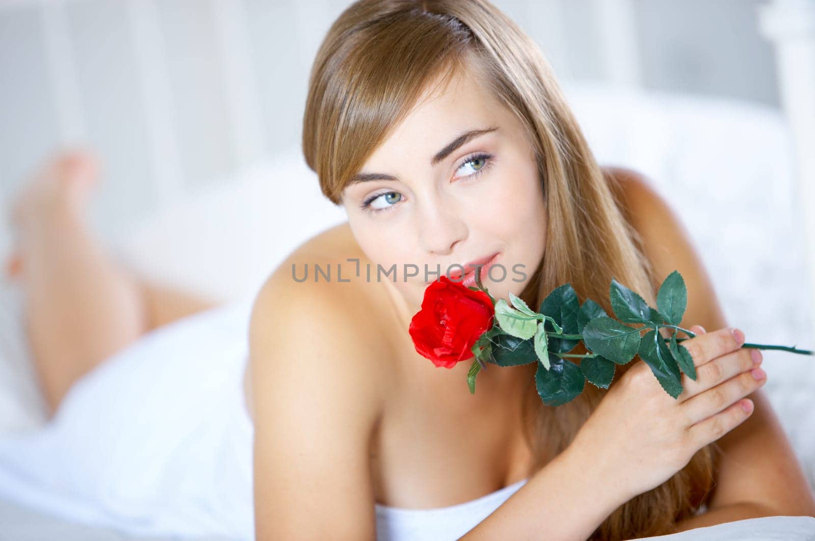 Beautiful teenager on white bed at her home
