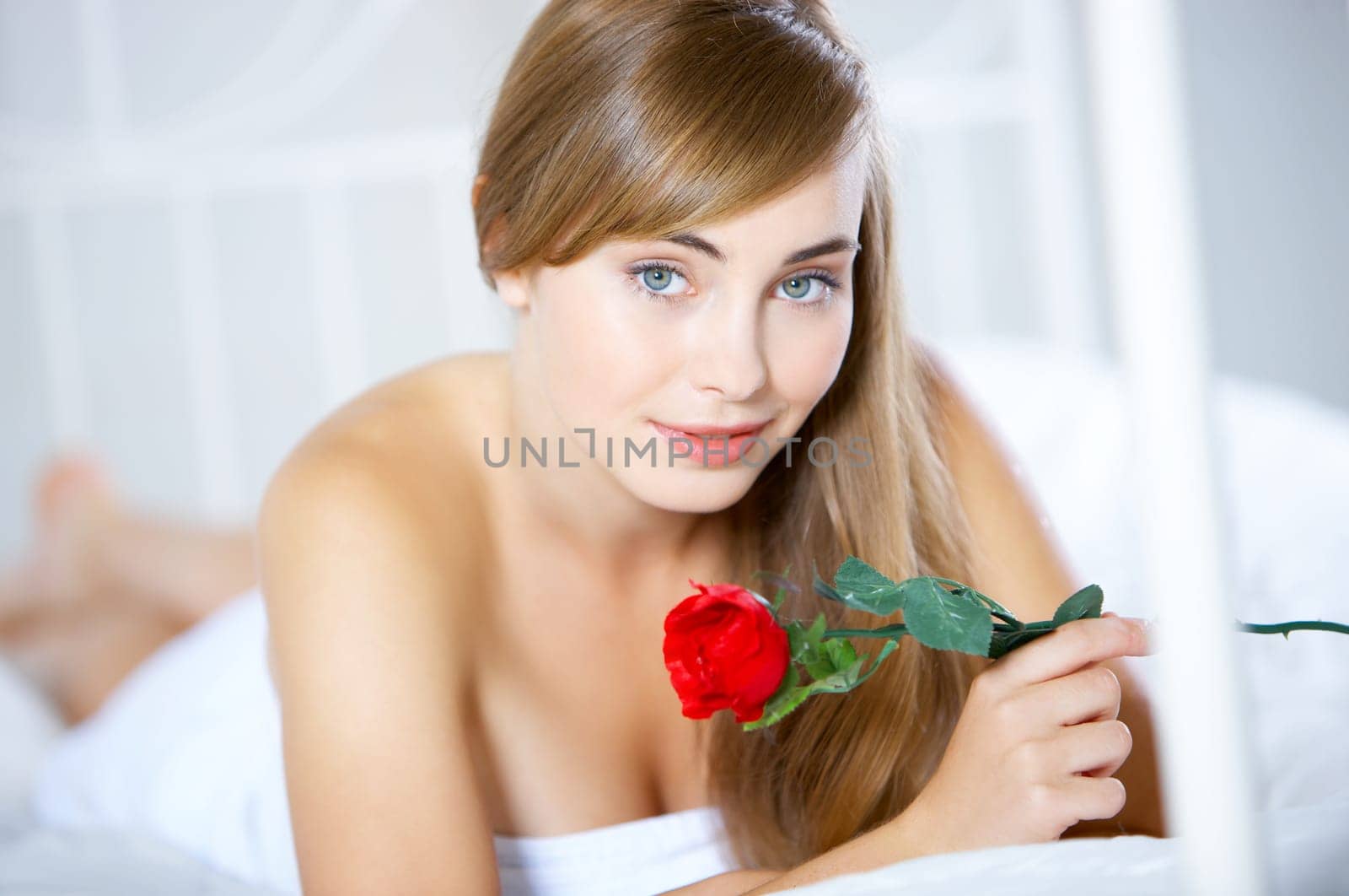 Beautiful teenager on white bed at her home