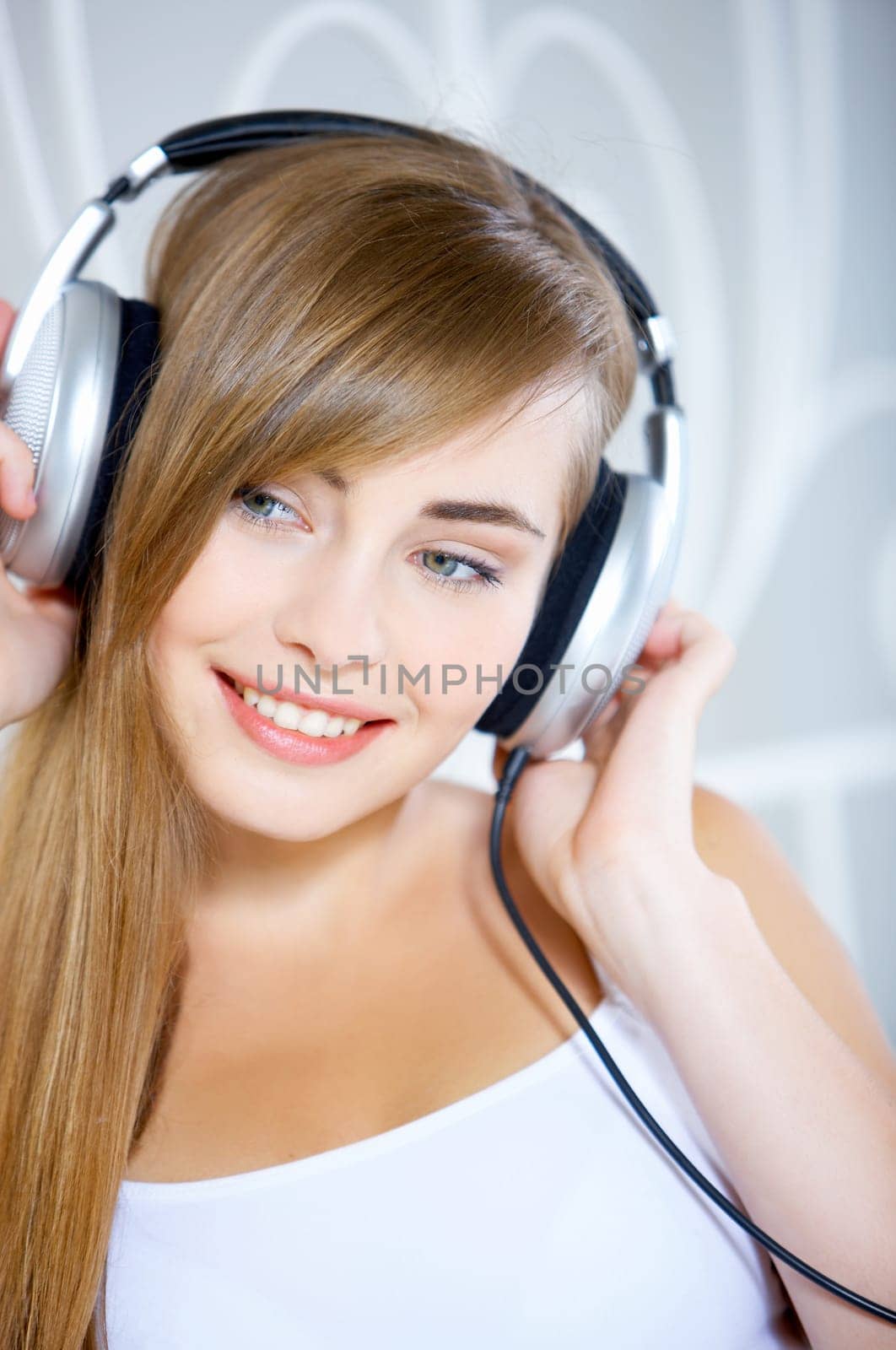Portrait of cute teenage girl is listening music