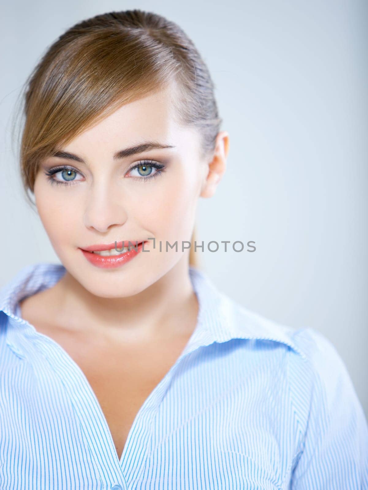 Portrait of beautiful business woman isolated on blue