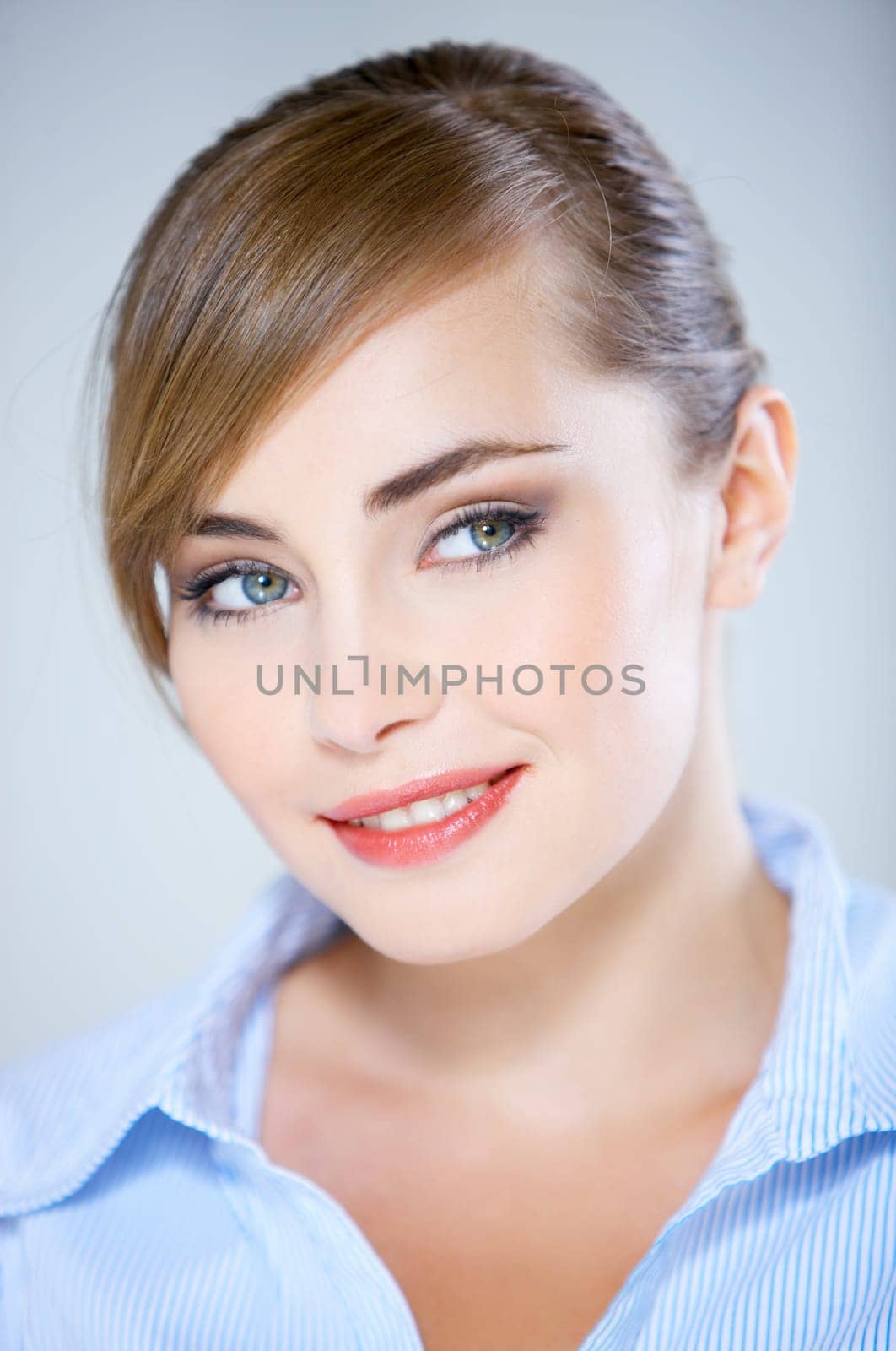 Portrait of beautiful business woman isolated on blue