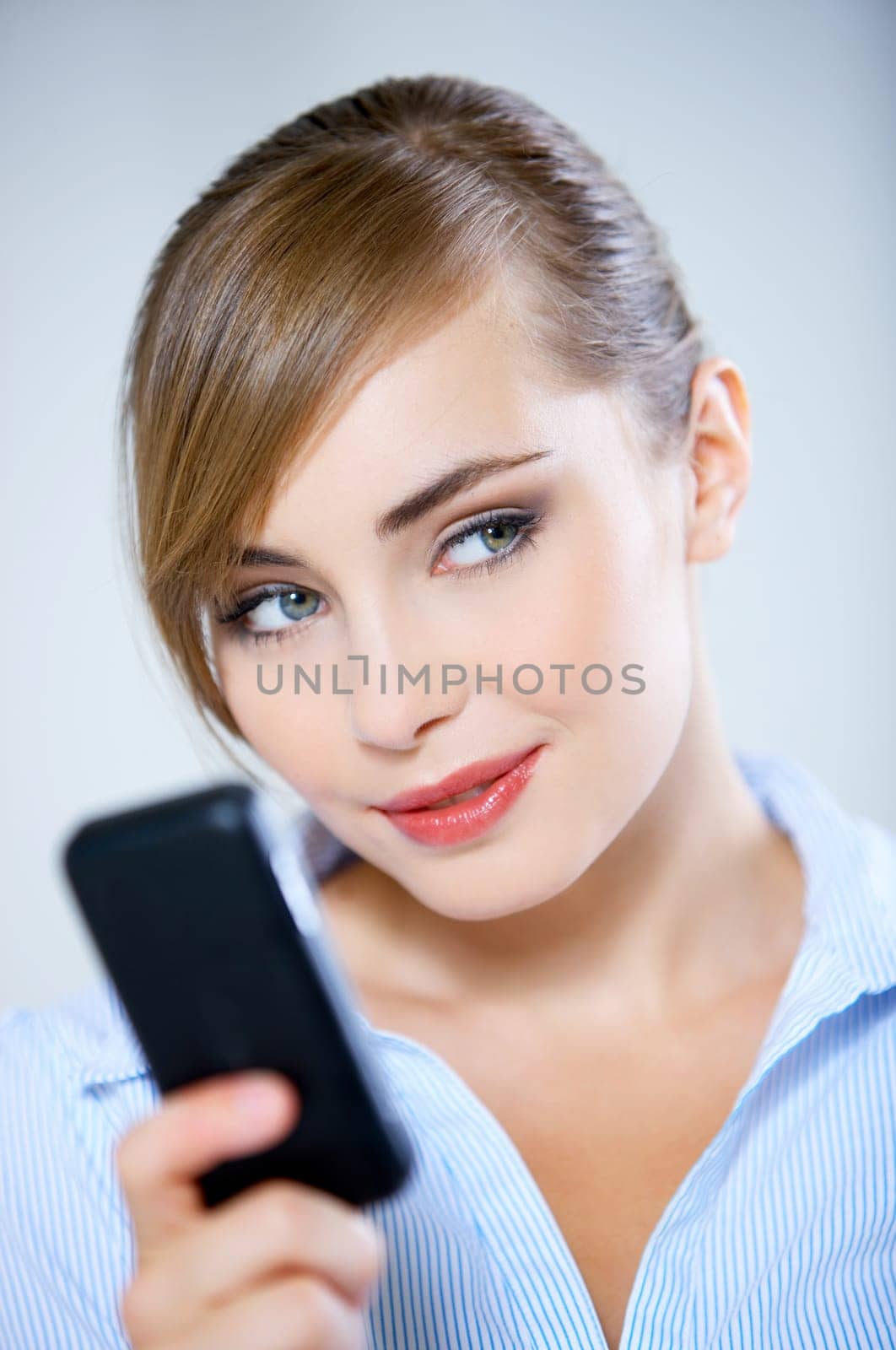 Portrait of beautiful business woman using mobile phone