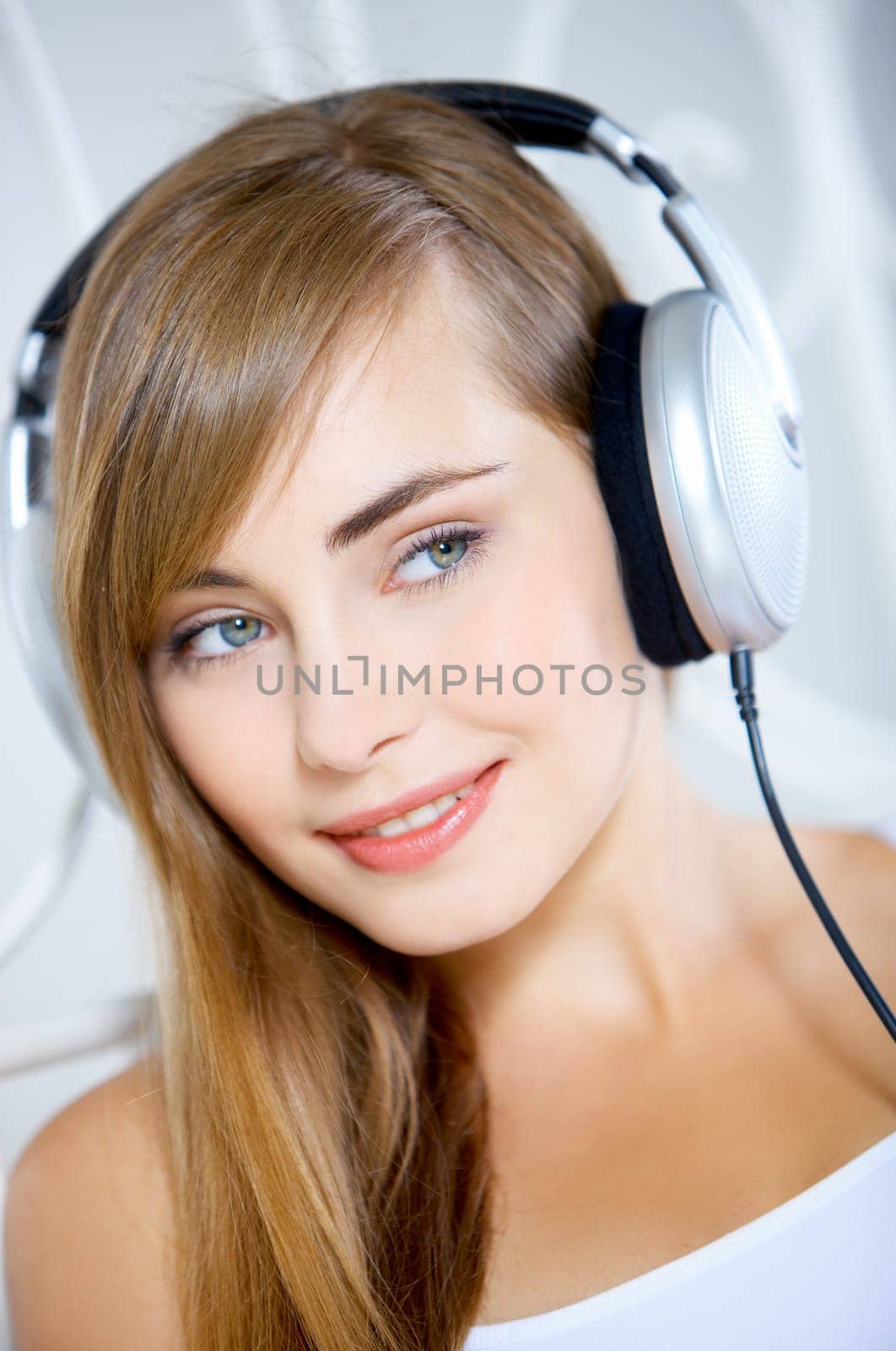 Portrait of cute teenage girl is listening music