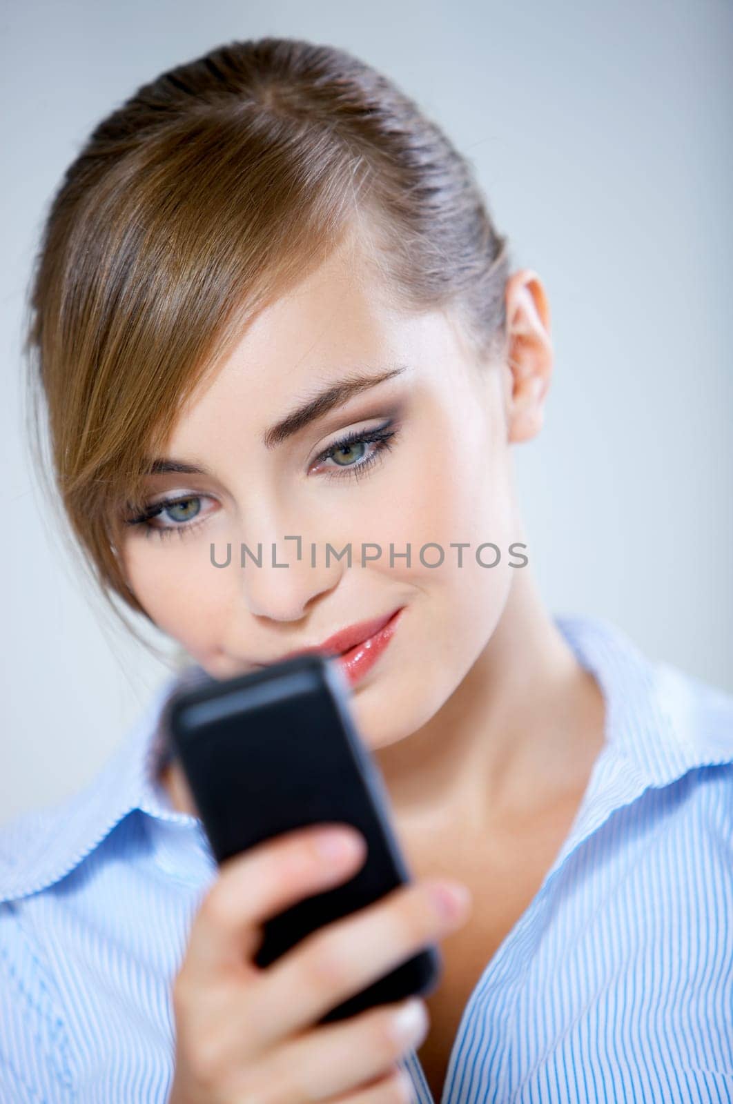 Portrait of beautiful business woman using mobile phone