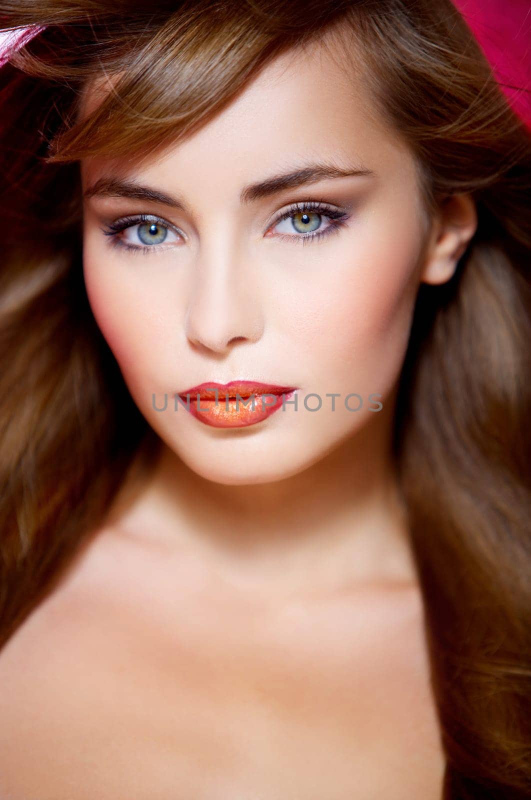 Portrait of beautiful young sexy woman on red background