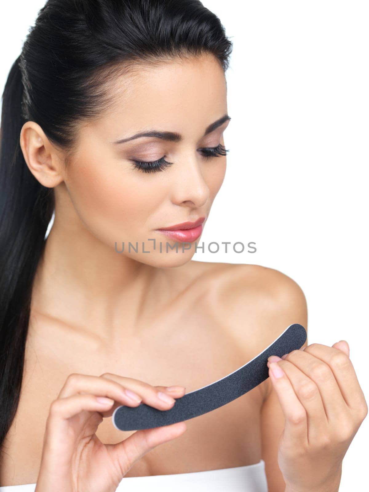 Portrait of beautiful woman, she doing her fingernails
