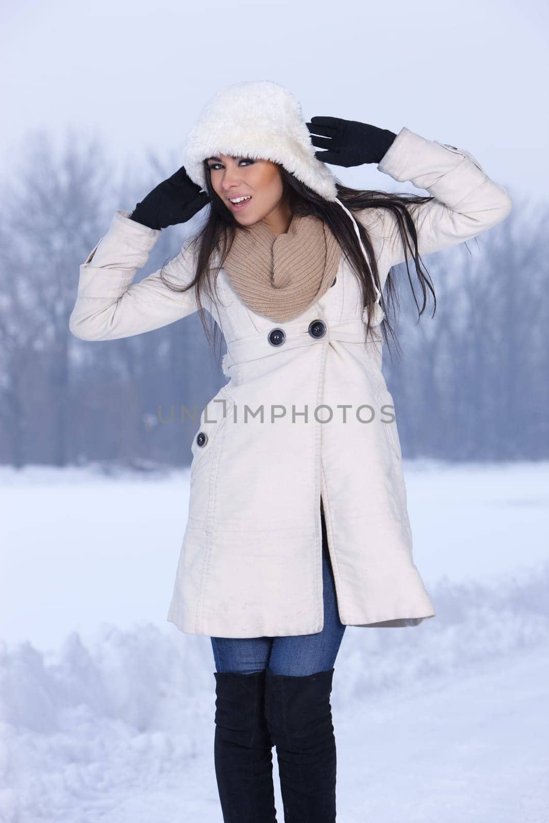 Beautiful and sexy woman in snowy winter outdoors