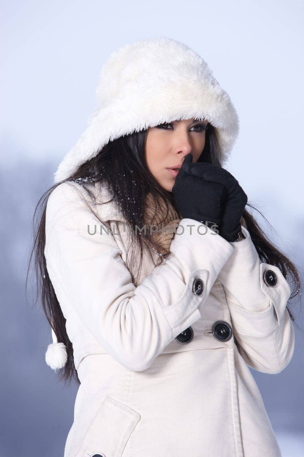 Beautiful and sexy woman in snowy winter outdoors