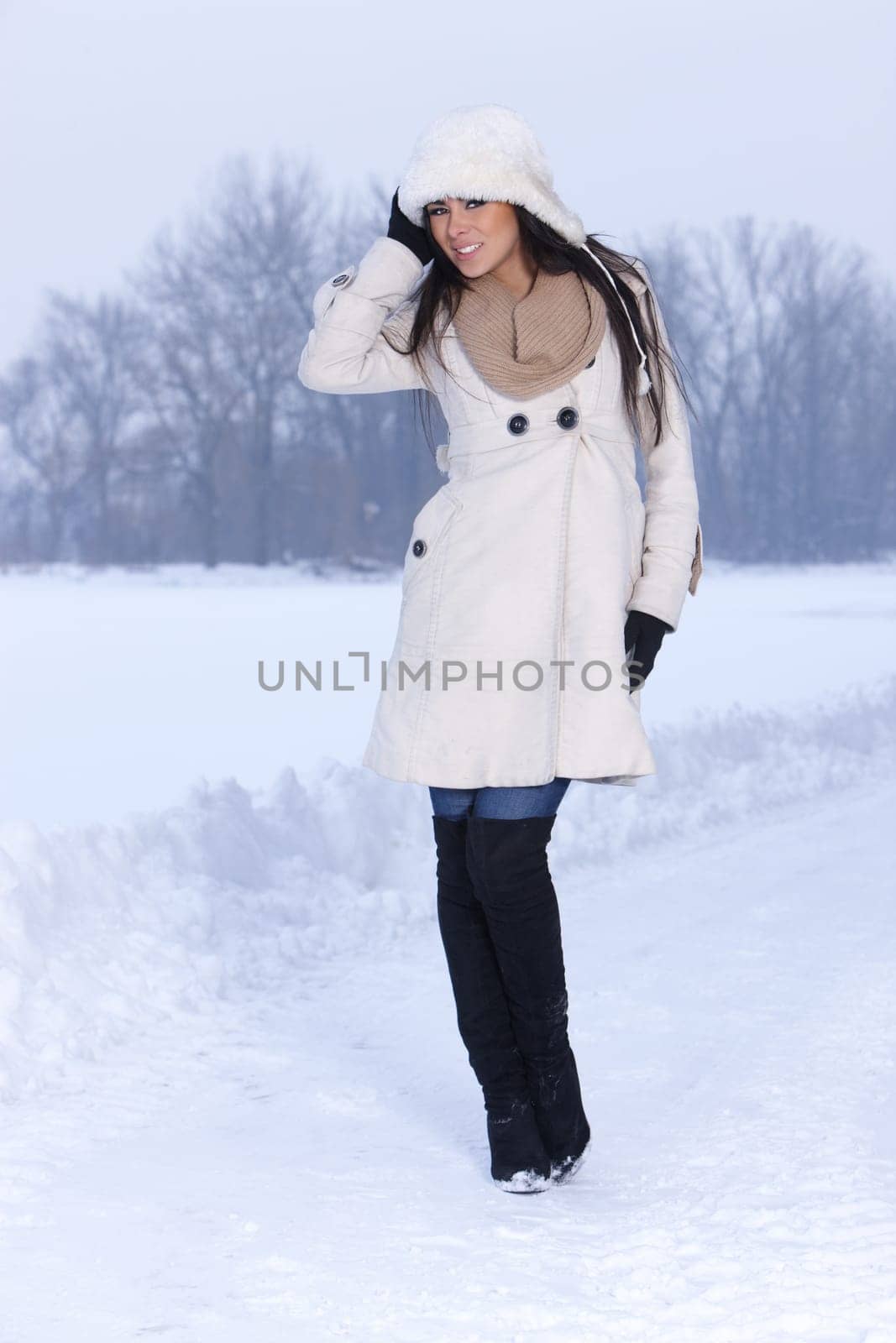 Beautiful and sexy woman in snowy winter outdoors