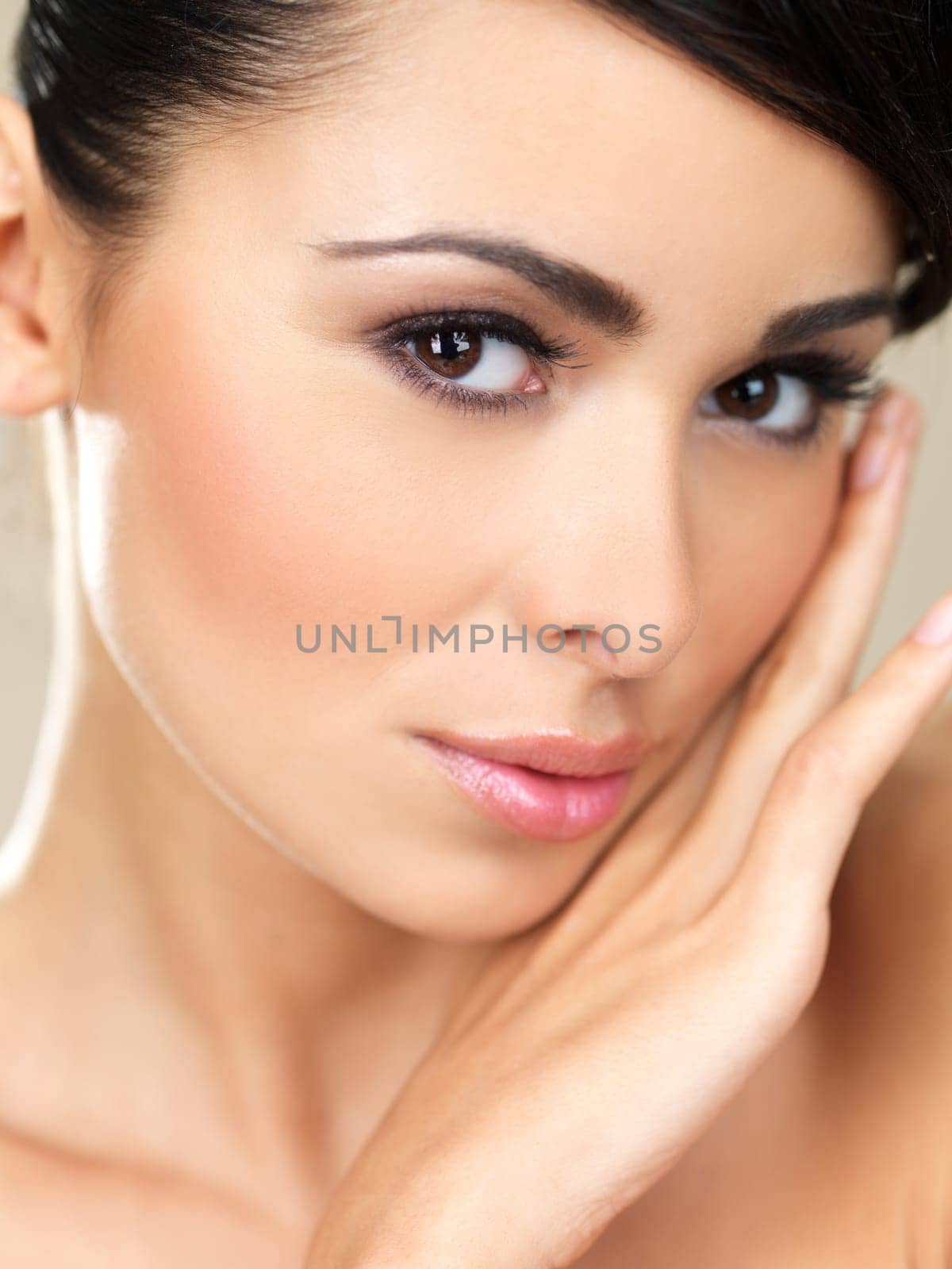 Portrait of beautiful woman on natural background