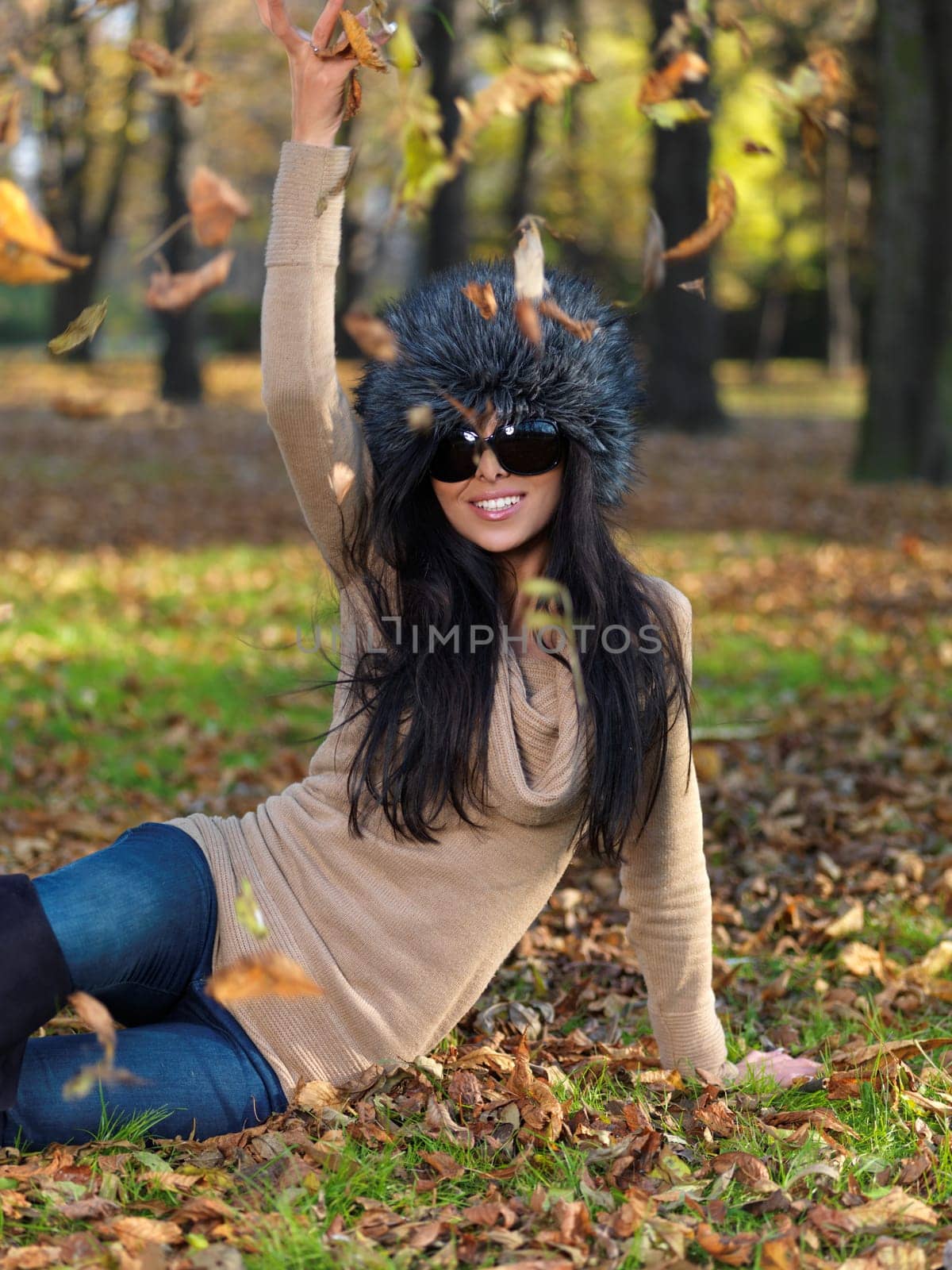 Beautiful woman spending time in park during autumn season