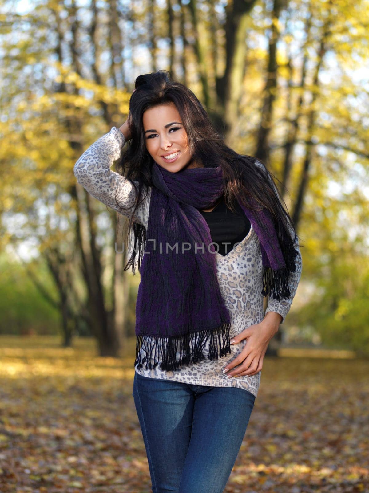 Beautiful woman spending time in park during autumn season
