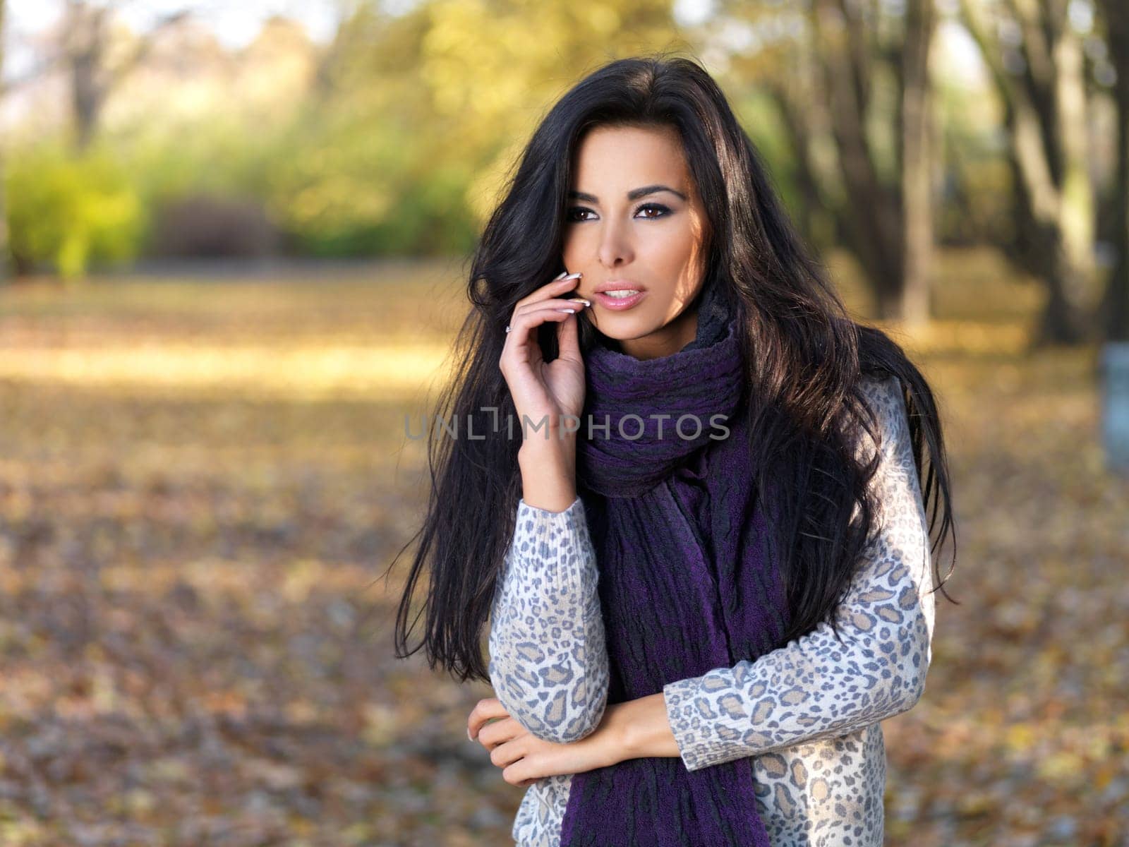 Beautiful woman spending time in park during autumn season