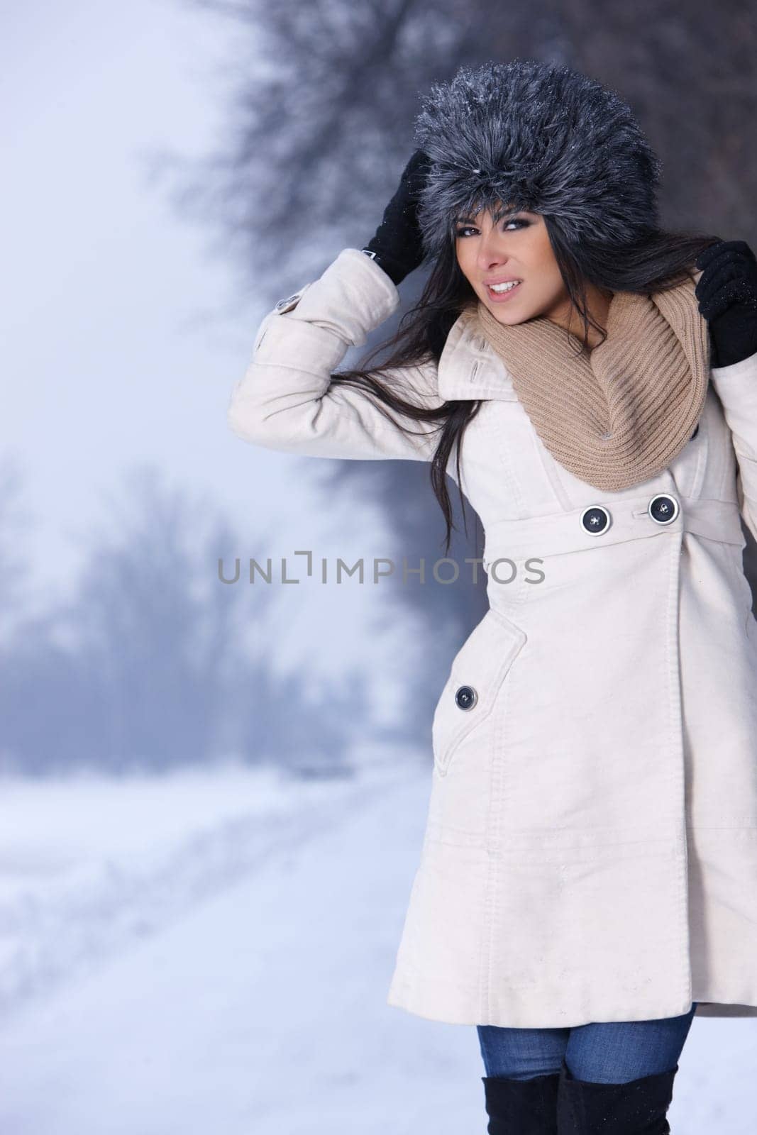 Beautiful and sexy woman in snowy winter outdoors