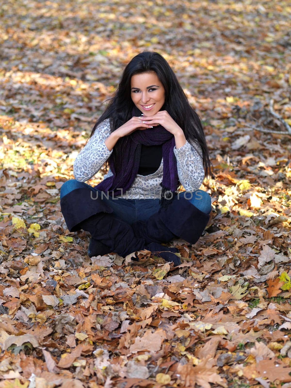 Beautiful woman spending time in park during autumn season
