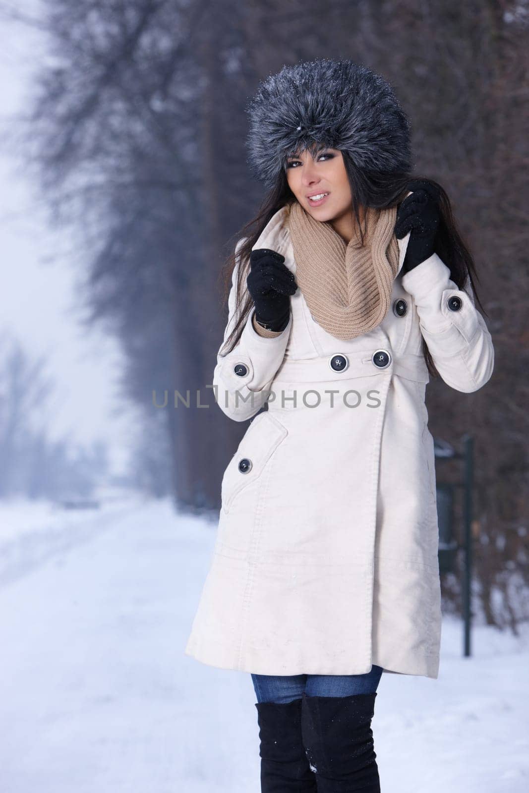Beautiful and sexy woman in snowy winter outdoors