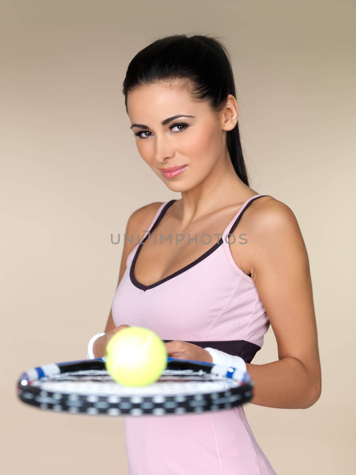 Beautiful female tennis player on natural background
