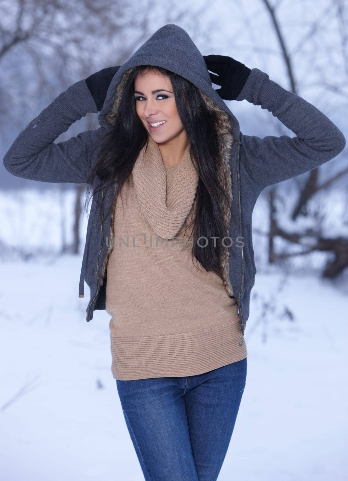 Beautiful and sexy woman in snowy winter outdoors