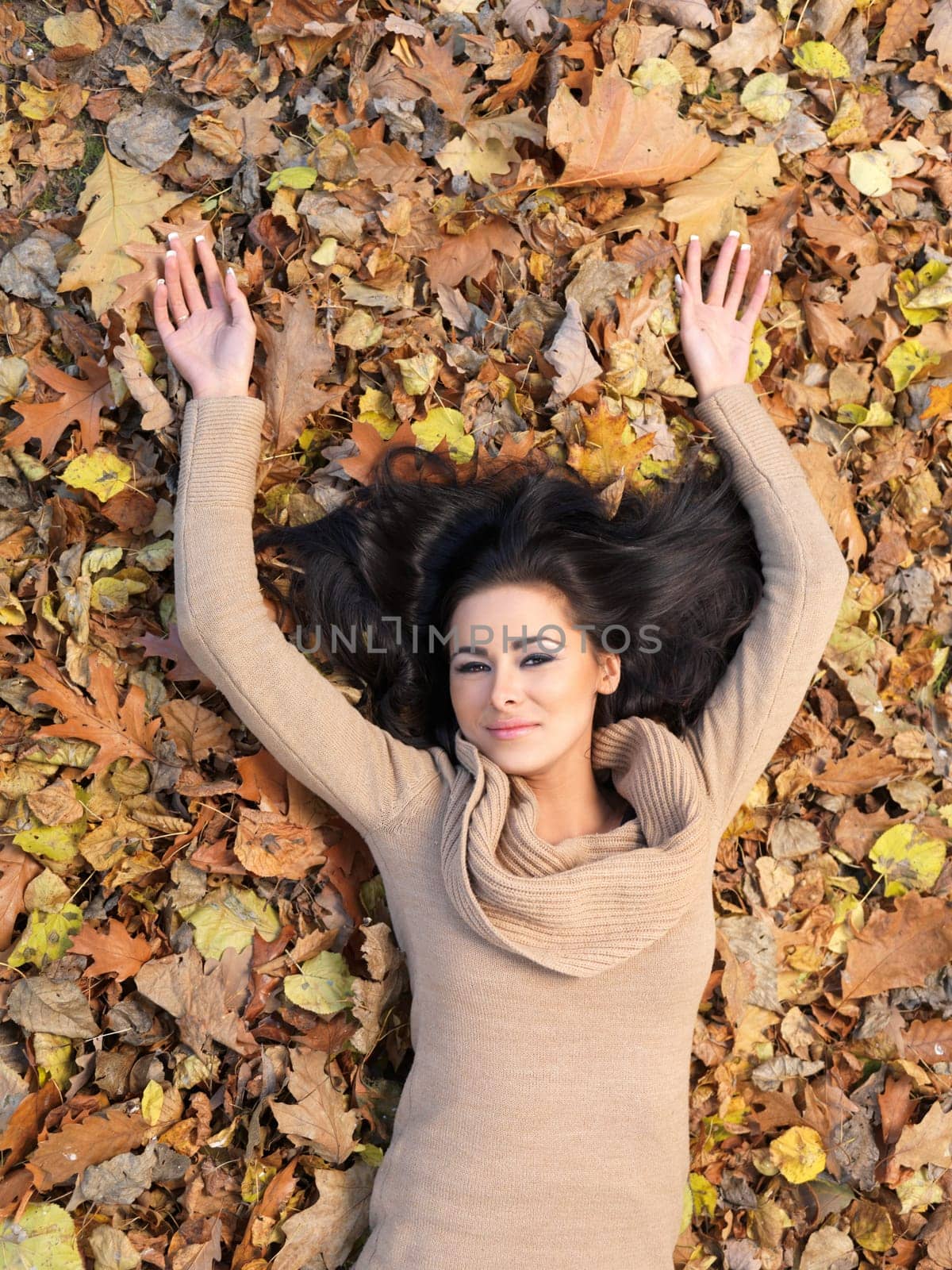 Beautiful woman spending time in park during autumn season