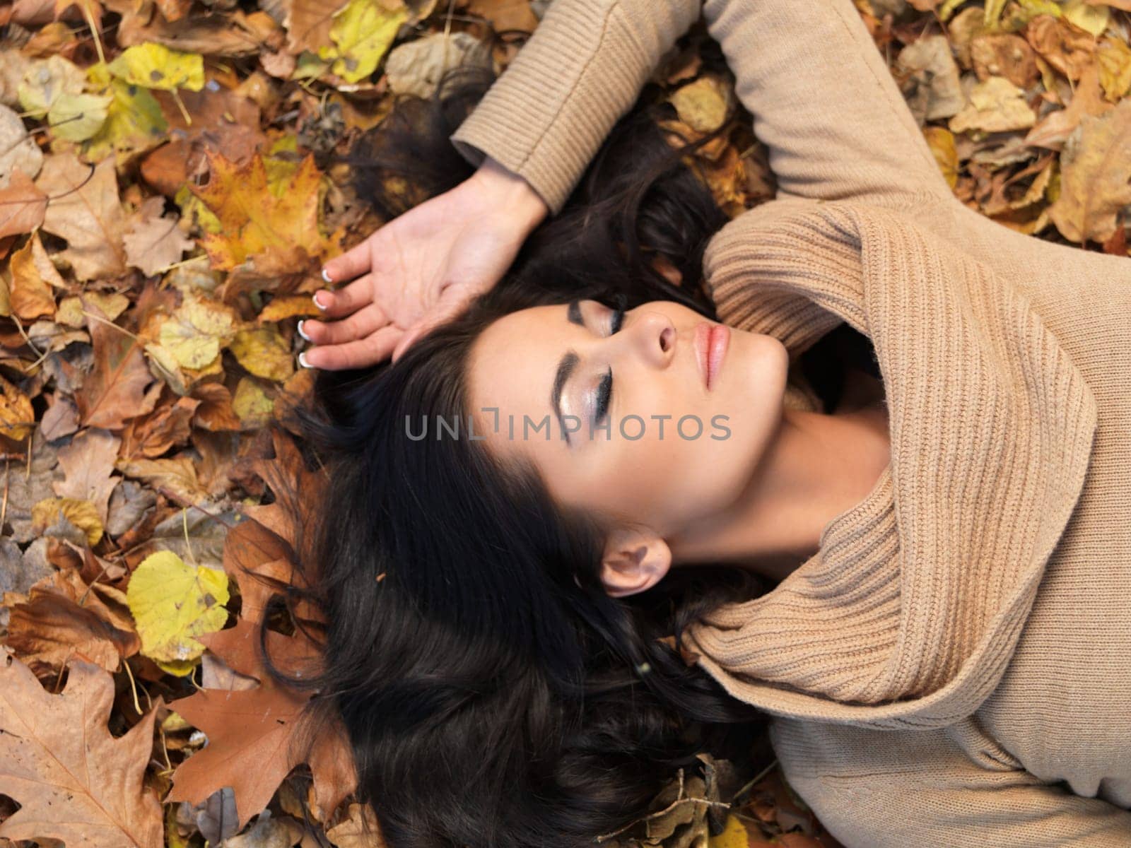 Beautiful woman spending time in park during autumn season