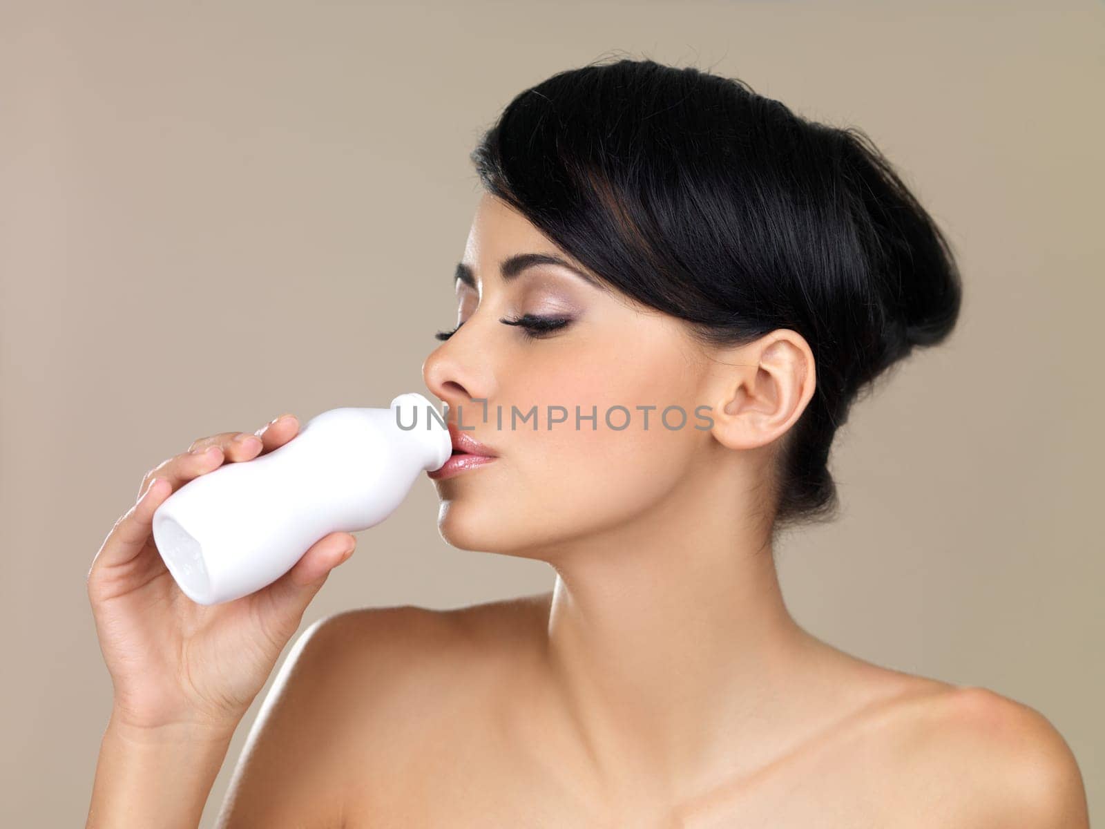 Portrait of beautiful woman, she holding bottle of milk