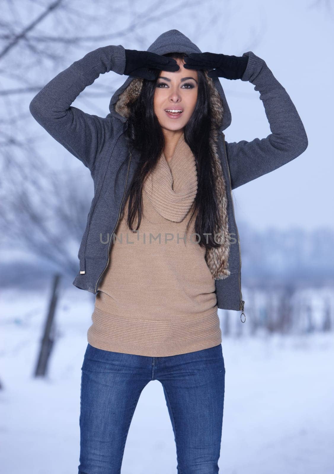 Beautiful and sexy woman in snowy winter outdoors