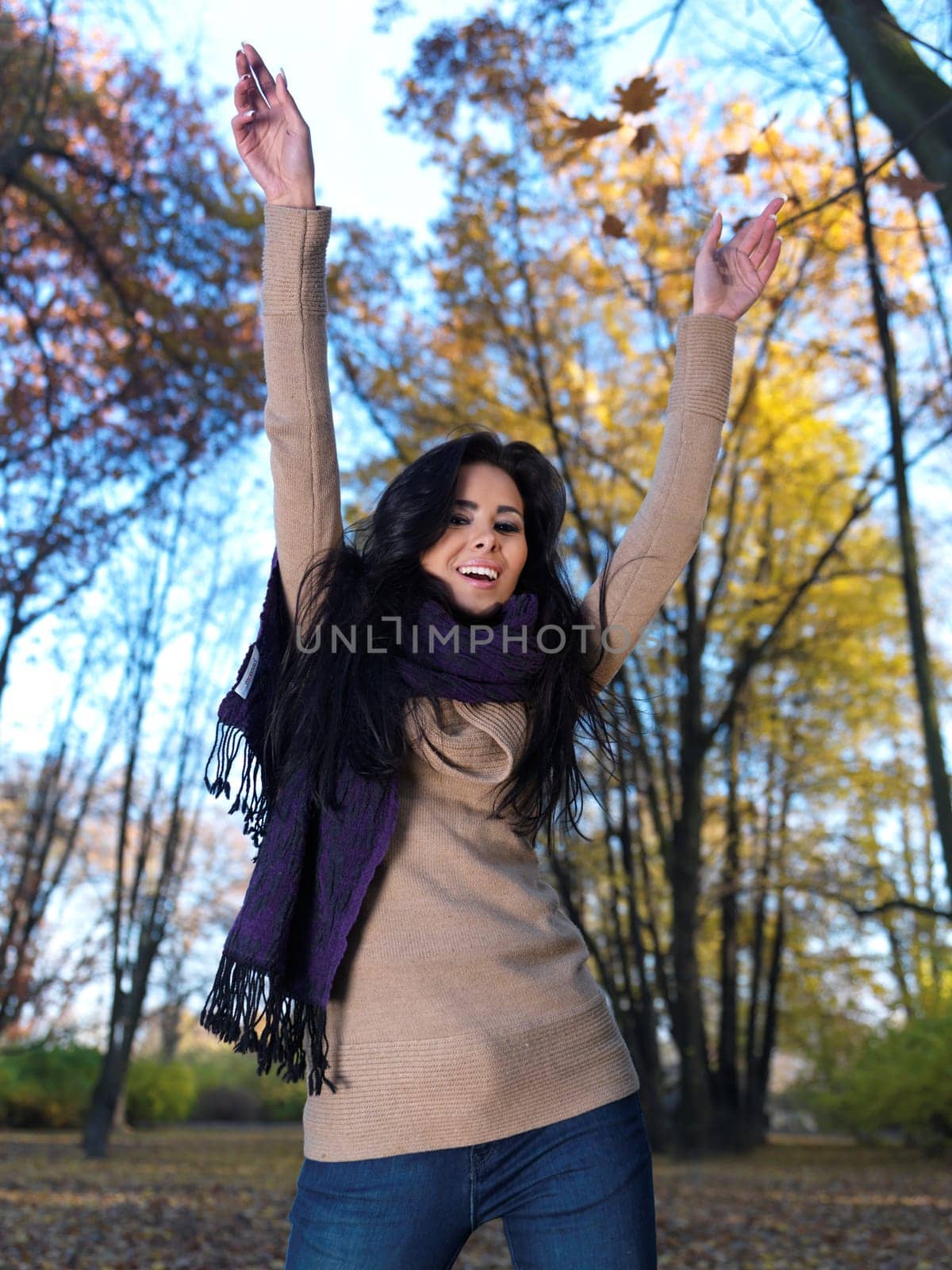 Beautiful woman spending time in park during autumn season