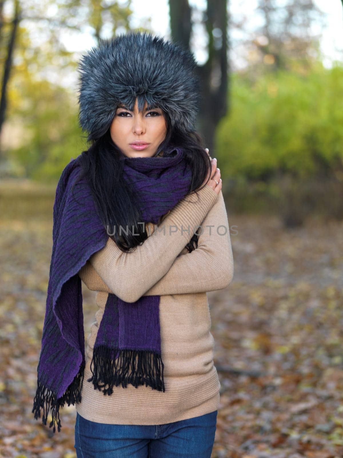 Beautiful woman spending time in park during autumn season