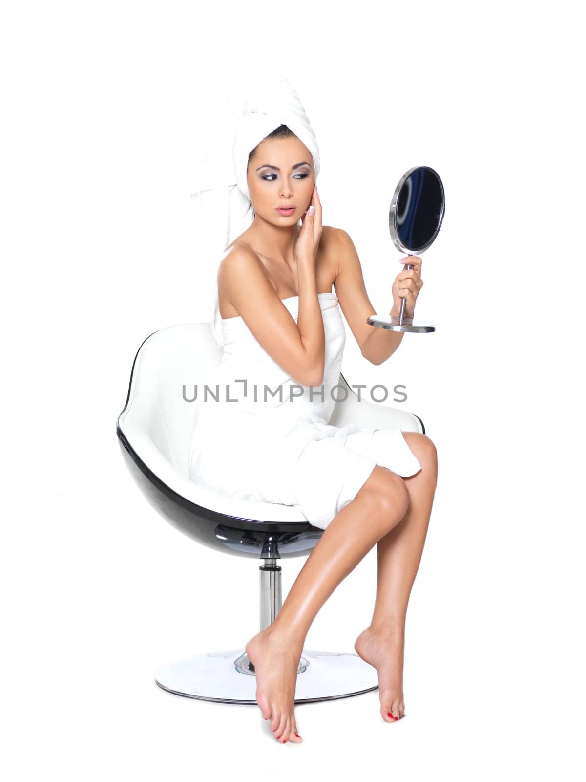 Beautiful and sexy woman wrapped in white towel