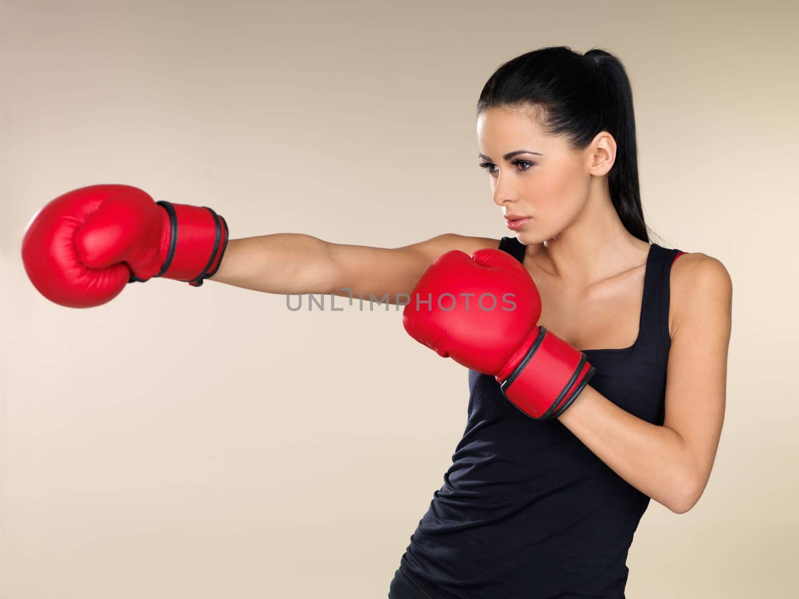 Young beautiful woman during fitness and boxing