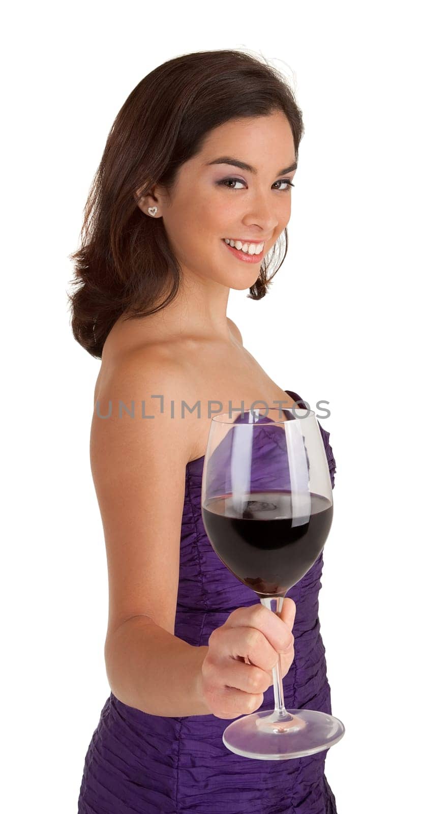 A beautiful woman in a classy dress is serving a glass of wine.