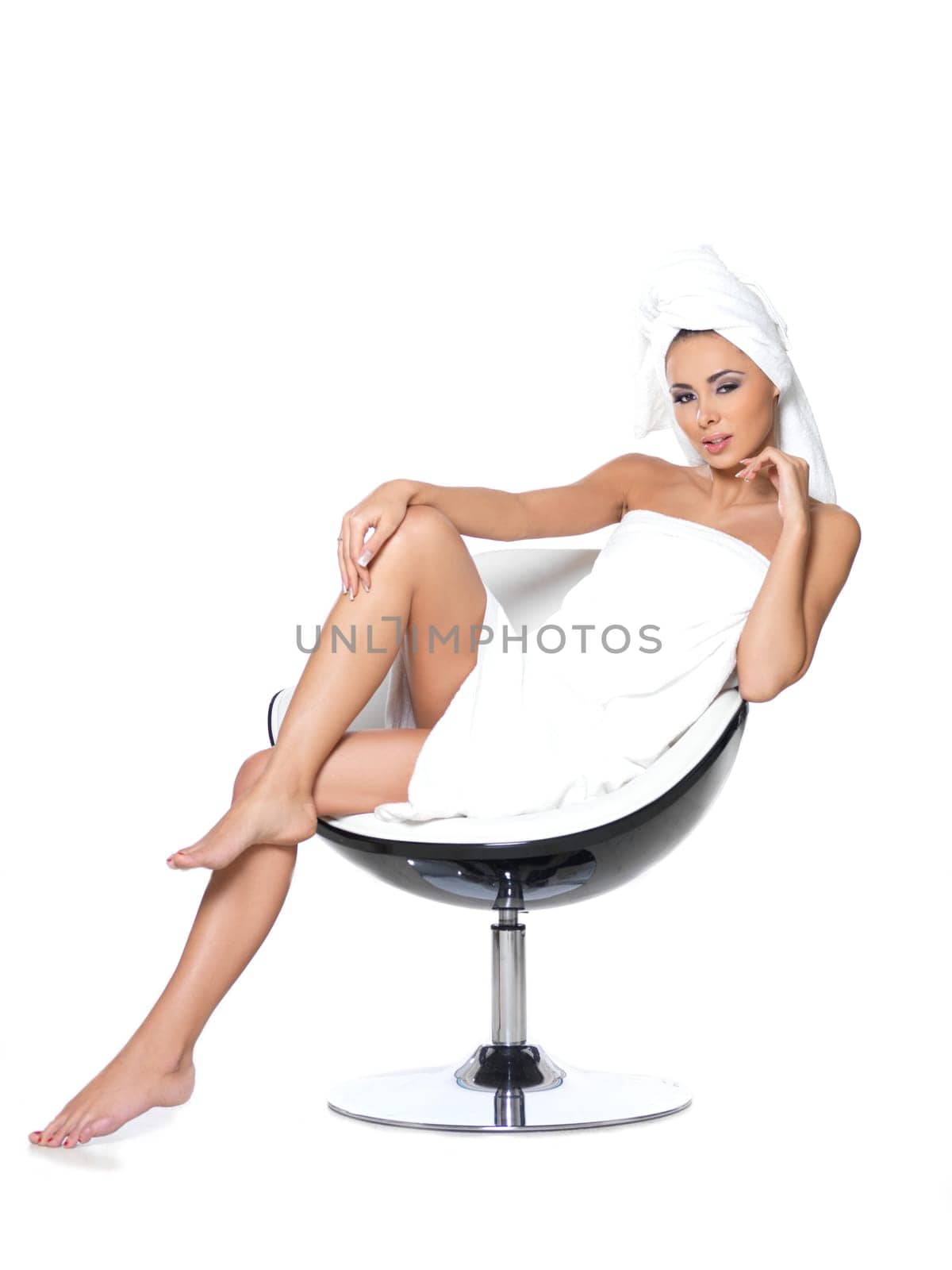 Beautiful and sexy woman wrapped in white towel