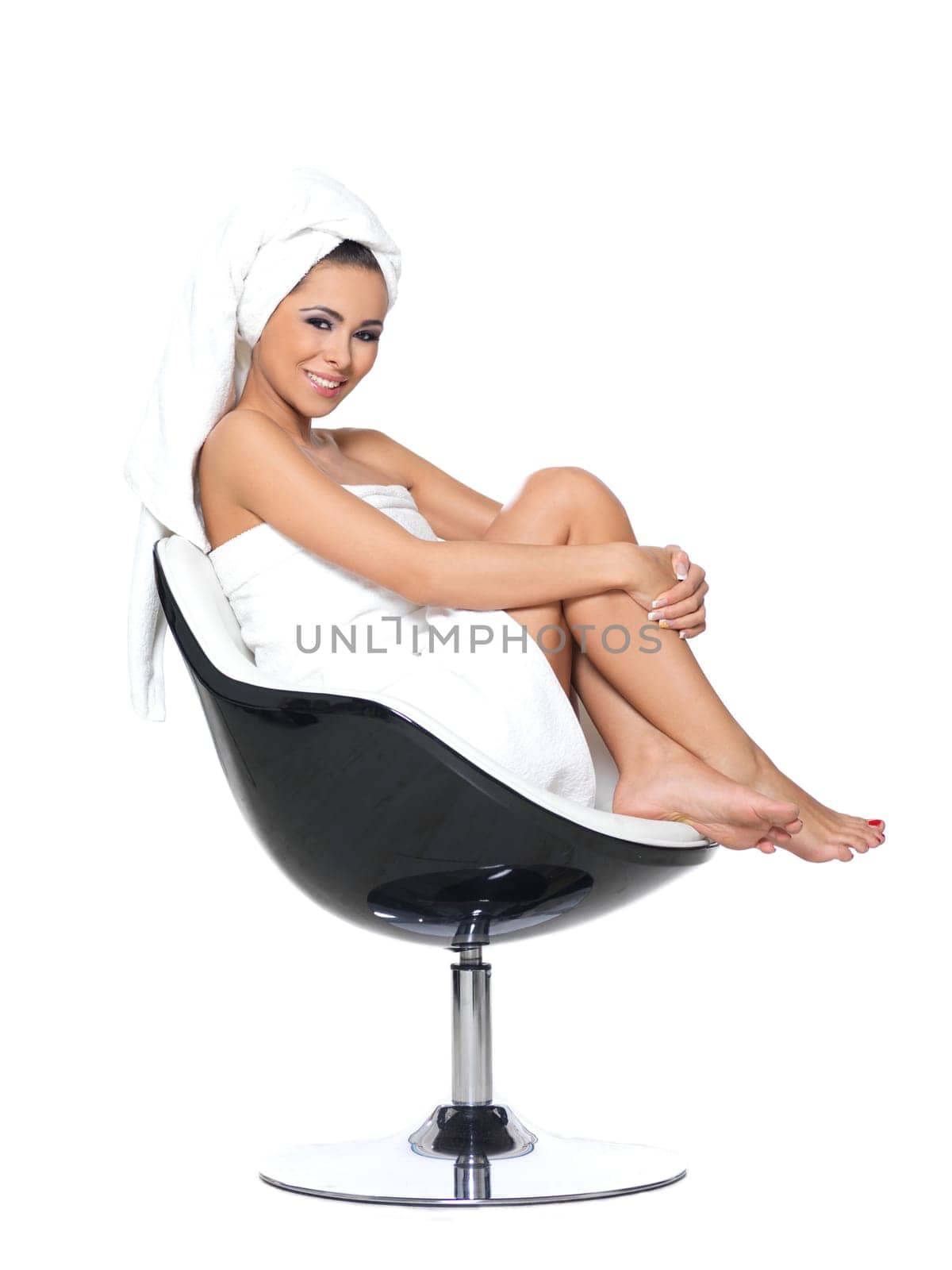 Beautiful and sexy woman wrapped in white towel