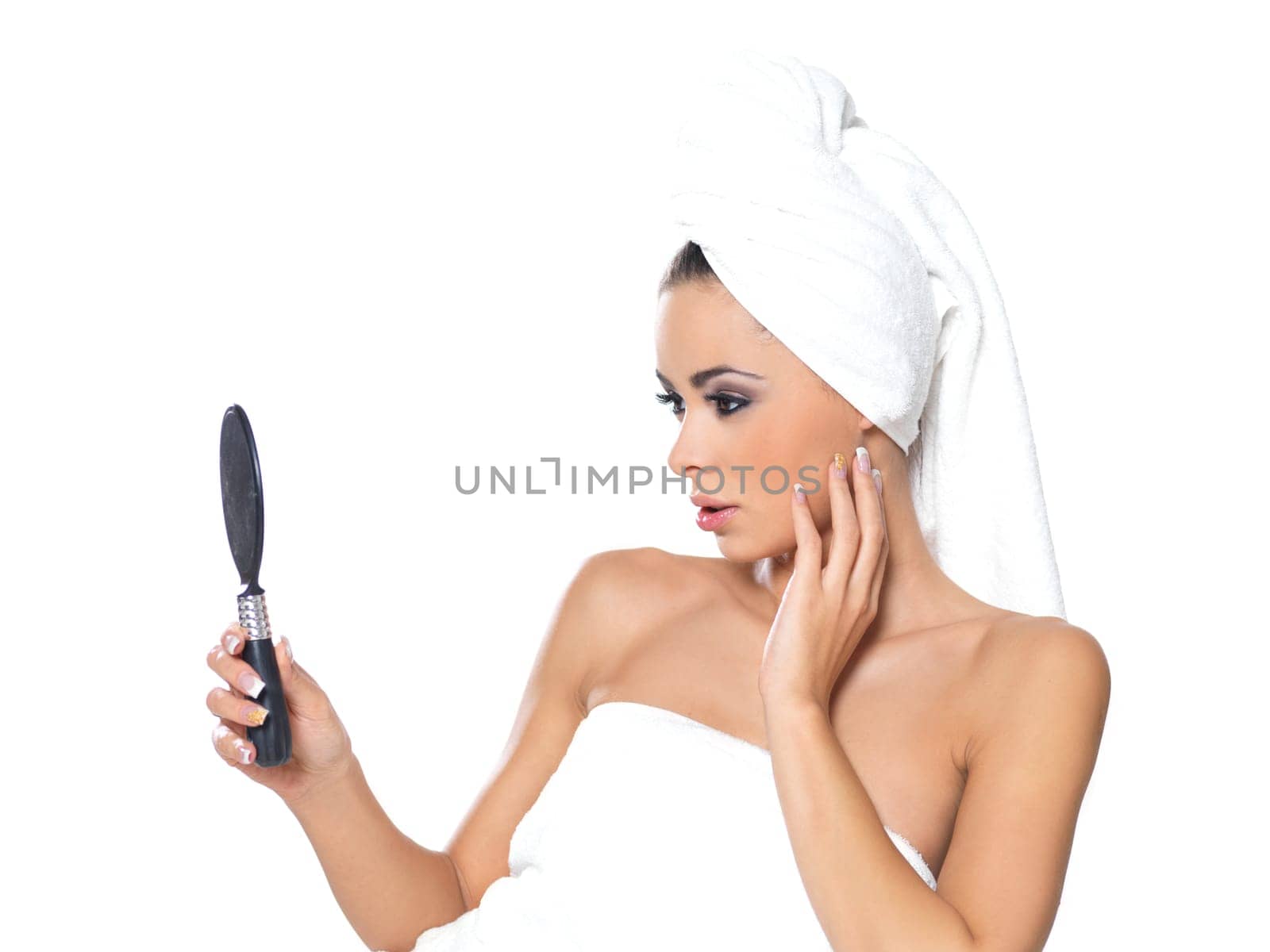 Beautiful and sexy woman wrapped in white towel