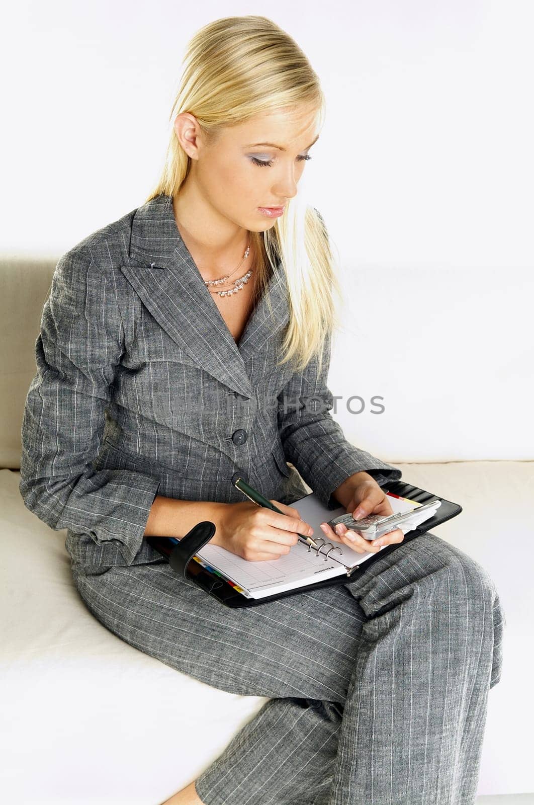 Young business woman talking by phone