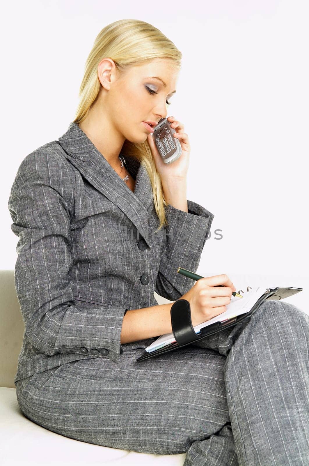 Young business woman talking by phone