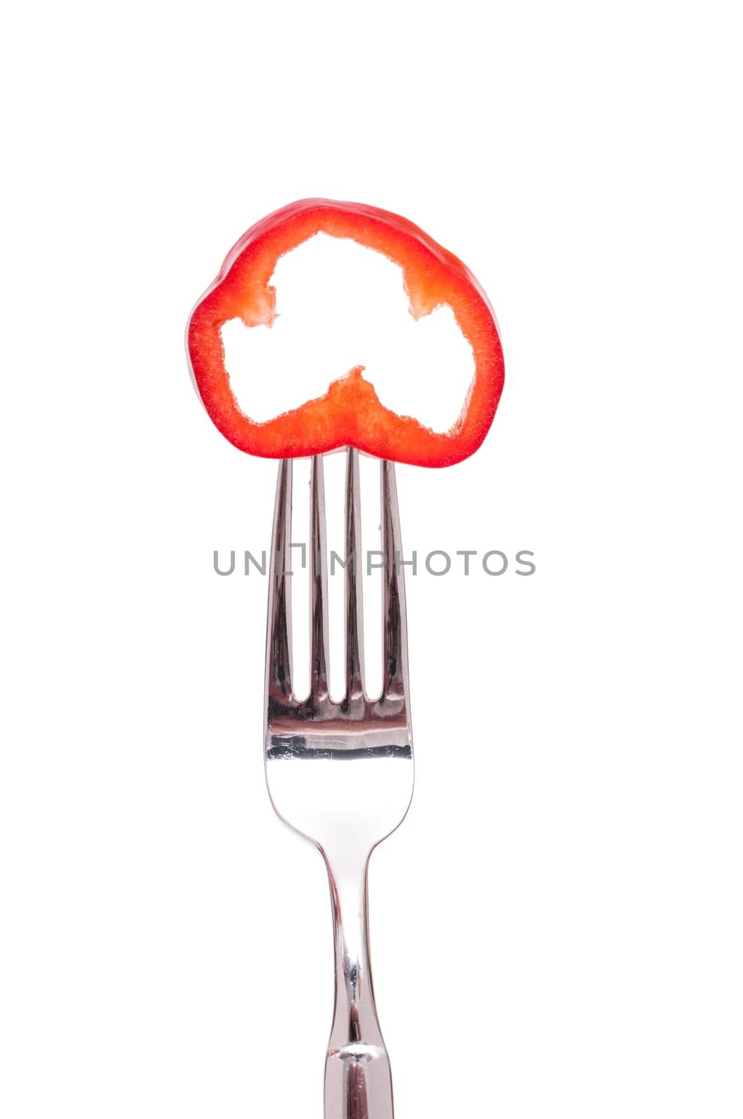 White isolated red bell pepper on a fork