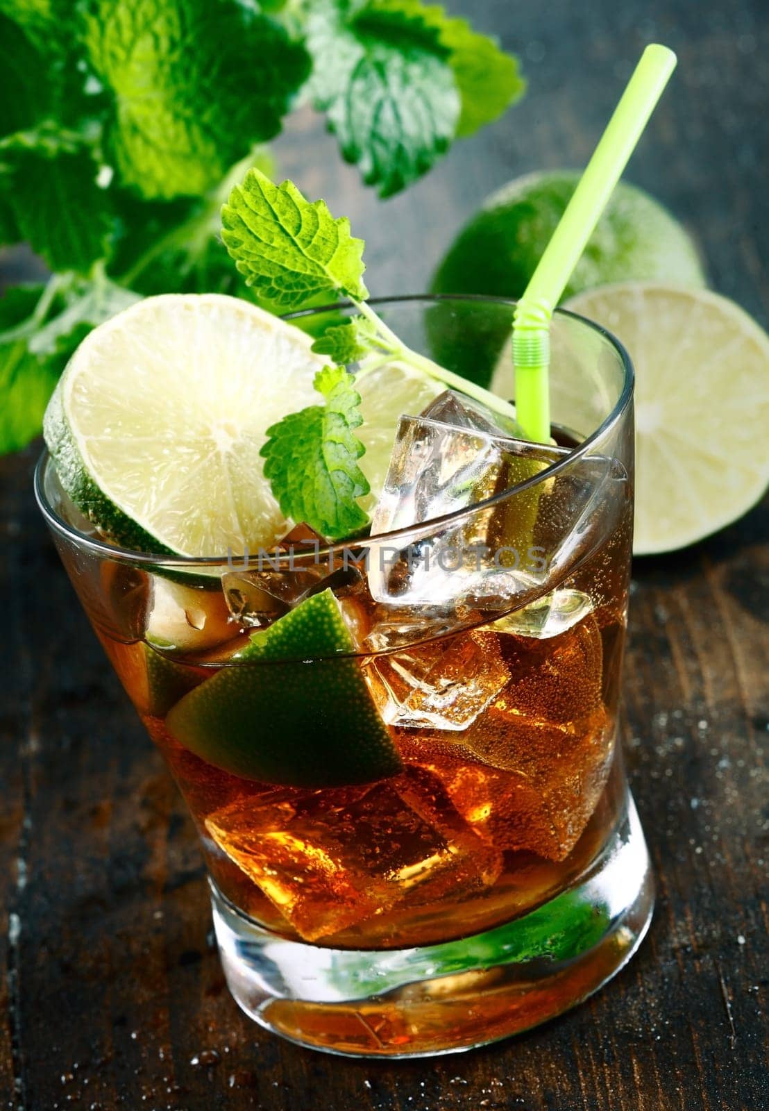 Cuba Libre Drink with lime and Cola,on a wooden plate